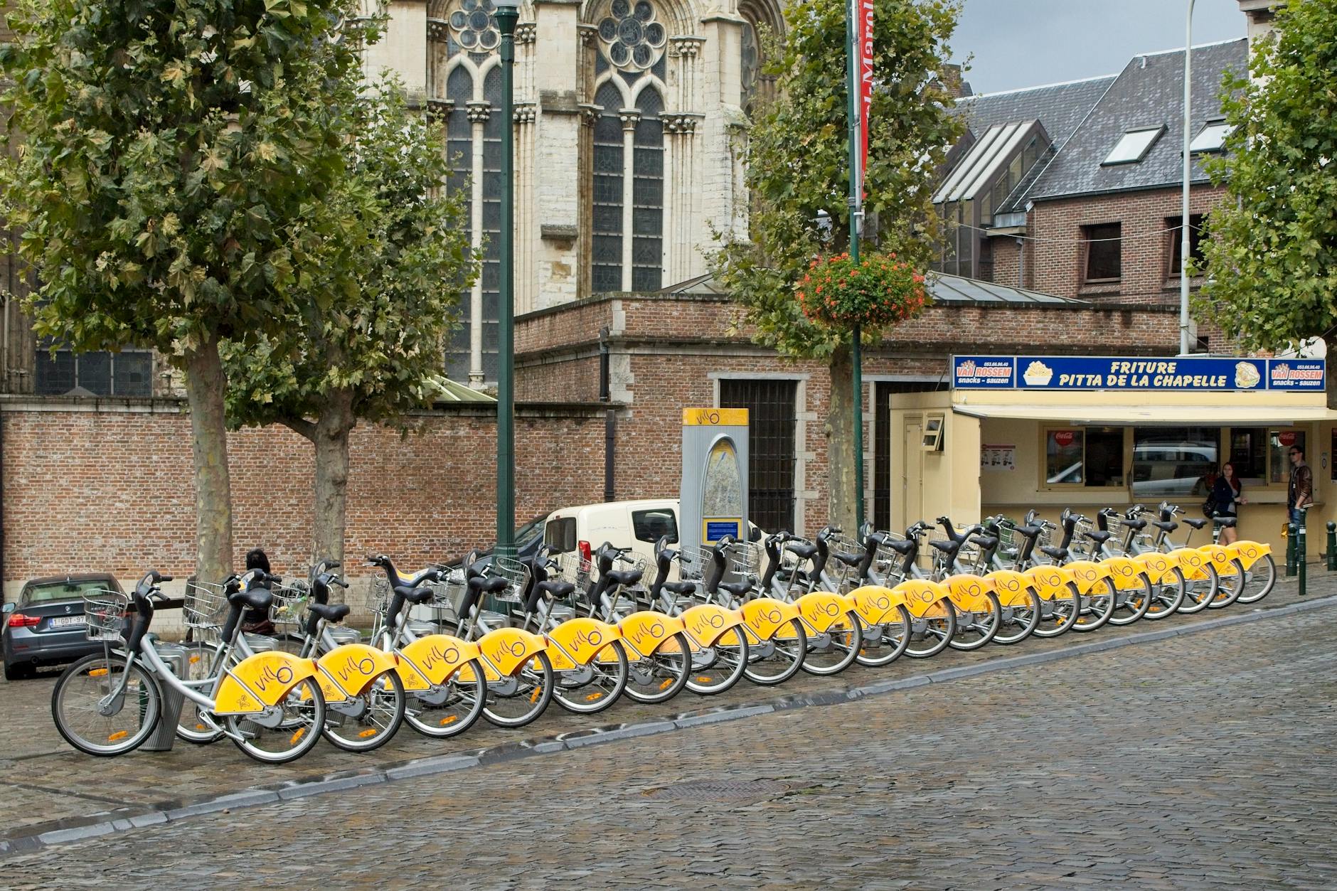 Bicycle rental on cobblestone streets in Florence Italy eco-friendly transport