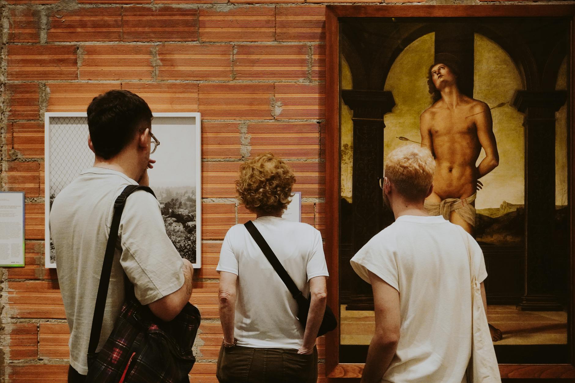 Visitors admiring artwork in a Florence museum gallery