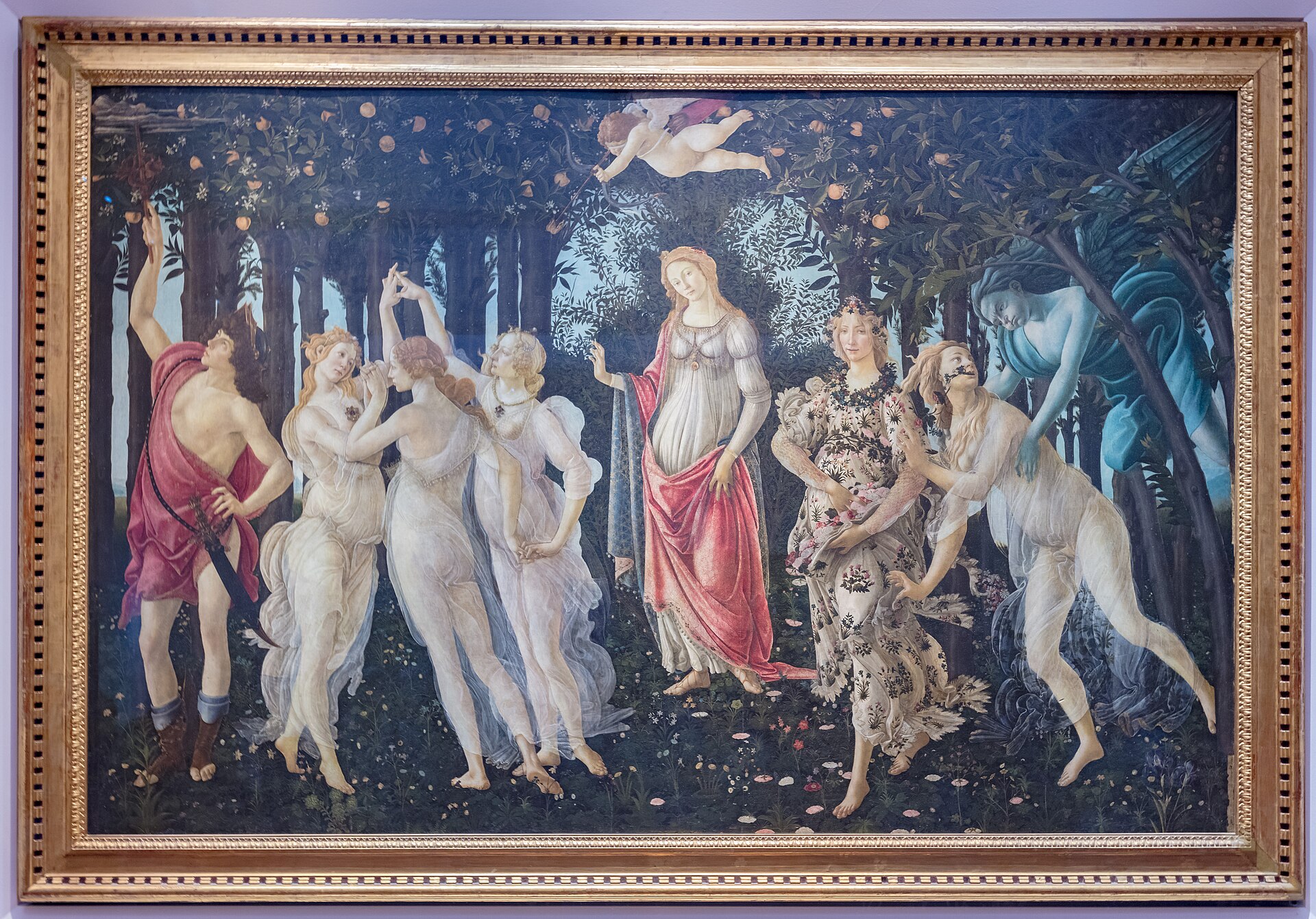Botticelli's Primavera hanging on the wall in the Uffizi Gallery