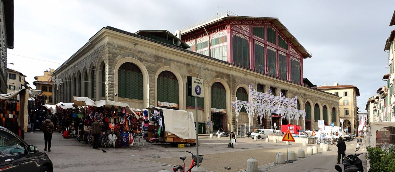 The Mercato Centrale in Florence in winter with the covered leather and clothing stalls of the San Lorenzo street market outside