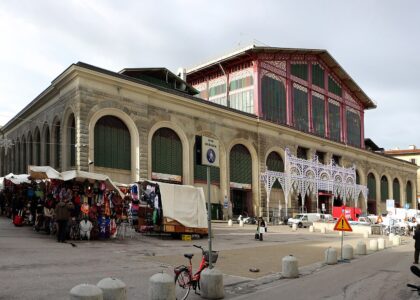 The Mercato Centrale in Florence in winter with the covered leather and clothing stalls of the San Lorenzo street market outside