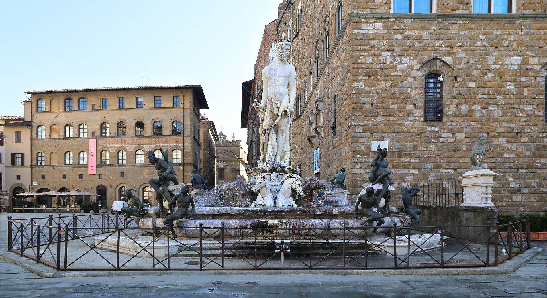 The Neptune fountain in Piazza della Signoria in early morning winter light, the square completely empty and the fountain drained