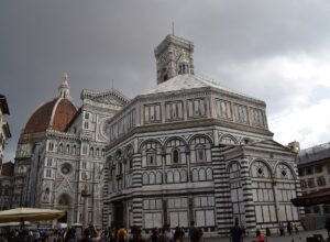 The Baptistery, cathedral facade, Giotto's bell tower and Brunelleschi's dome seen together across Piazza del Duomo in Florence